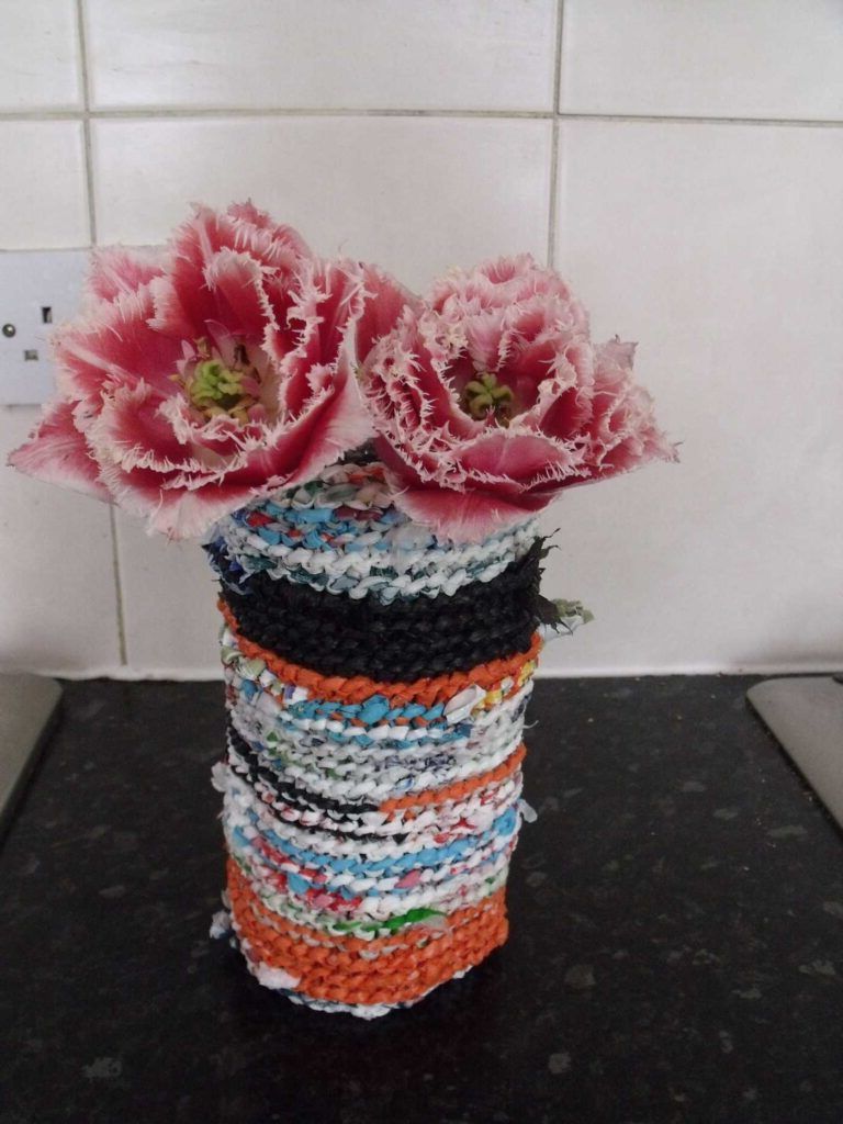 Vases decorated with knitted fabric