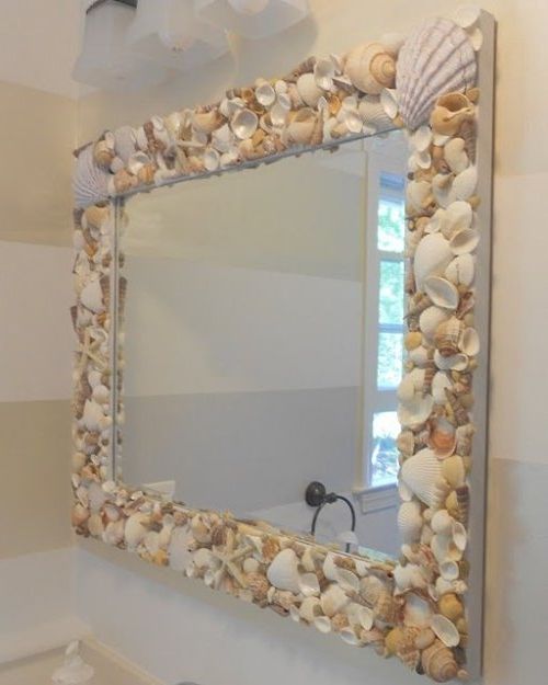 Mirror decoration with snails and shells